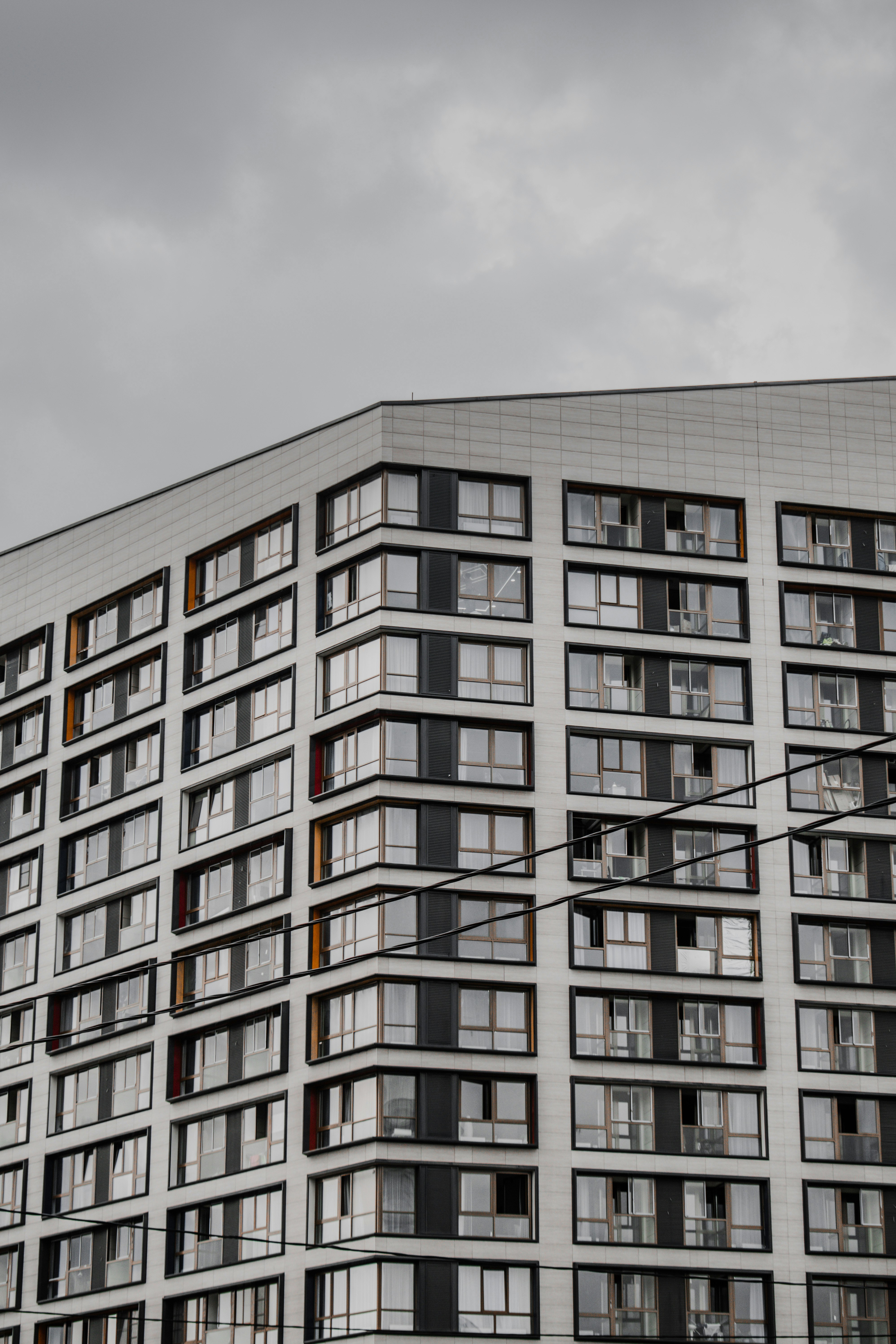 brown concrete building under gray sky